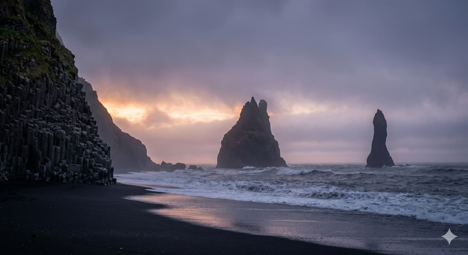 Reynisfjara black sand beach with Reynisdrangar sea stacks at dusk